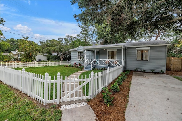 300 33rd Ave N, Saint Petersburg, FL 33704 - view of front facade featuring covered porch and a gate