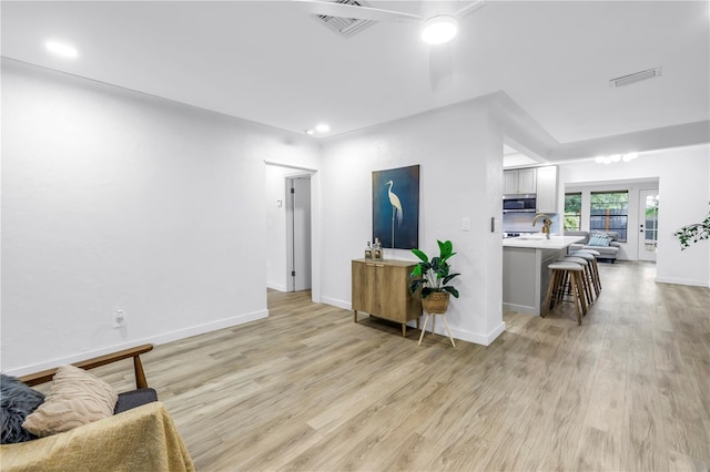 300 33rd Ave N, Saint Petersburg, FL 33704 - living room with light wood-style flooring, baseboards, and recessed lighting