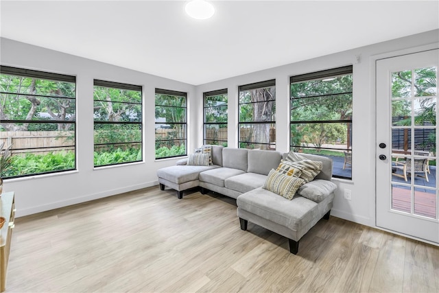 300 33rd Ave N, Saint Petersburg, FL 33704 - sunroom / solarium with french doors, wood finished floors, and baseboards