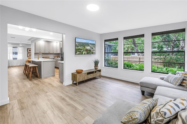 300 33rd Ave N, Saint Petersburg, FL 33704 - living area featuring light wood-type flooring and baseboards