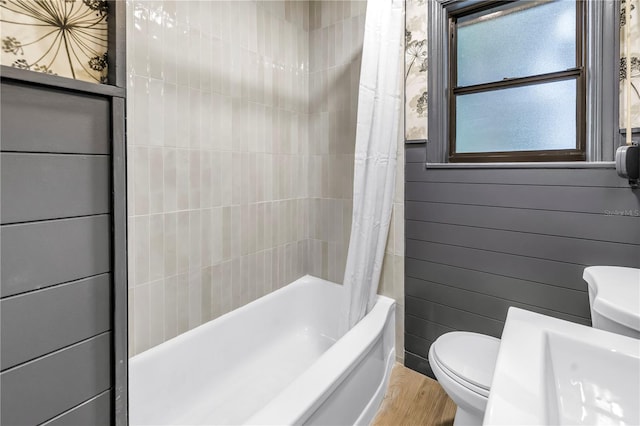 300 33rd Ave N, Saint Petersburg, FL 33704 - full bathroom with toilet, shower / tub combo, and wood finished floors