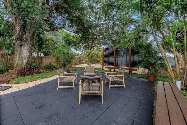 300 33rd Ave N, Saint Petersburg, FL 33704 - fenced backyard featuring a patio area