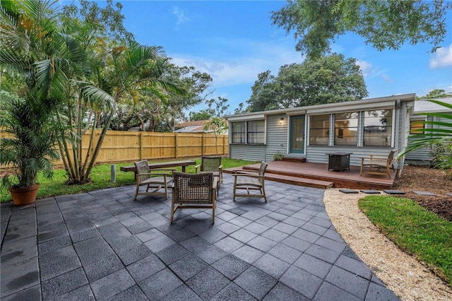300 33rd Ave N, Saint Petersburg, FL 33704 - view of patio / terrace featuring a wooden deck and outdoor dining area