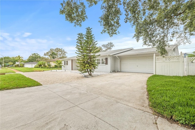 2554 Lake Ellen Cir, Tampa, FL 33618 - ranch-style house featuring concrete driveway and a garage
