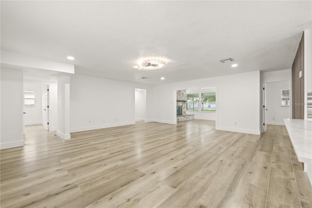 2554 Lake Ellen Cir, Tampa, FL 33618 - unfurnished living room with recessed lighting, light wood-style flooring, and baseboards