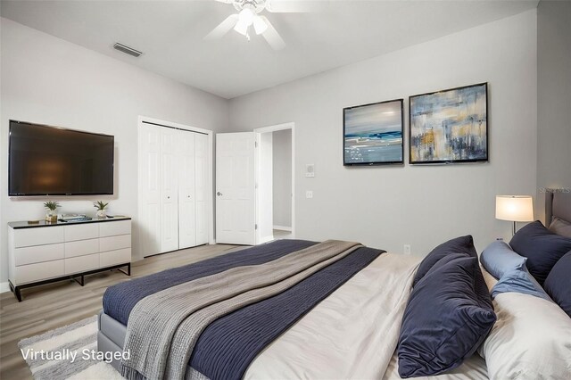 5160 Loquat Ct, Palm Harbor, FL 34685 - bedroom featuring light wood-style floors, a closet, and ceiling fan
