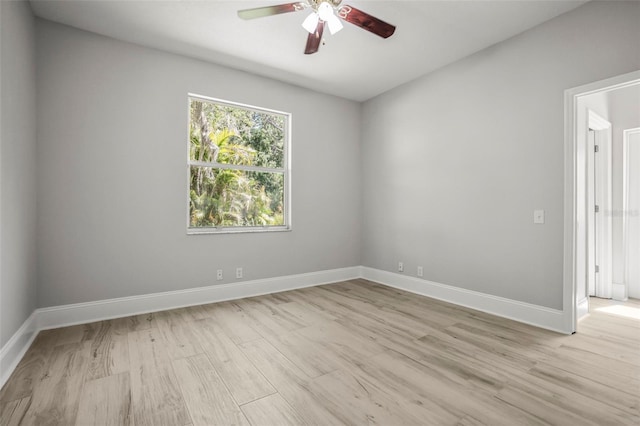 5160 Loquat Ct, Palm Harbor, FL 34685 - empty room with a ceiling fan, light wood finished floors, and baseboards