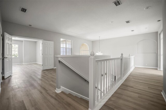 5160 Loquat Ct, Palm Harbor, FL 34685 - hall with an upstairs landing, baseboards, and wood finished floors