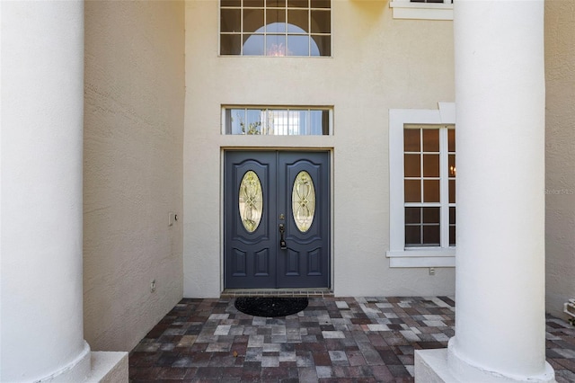 5160 Loquat Ct, Palm Harbor, FL 34685 - doorway to property featuring stucco siding