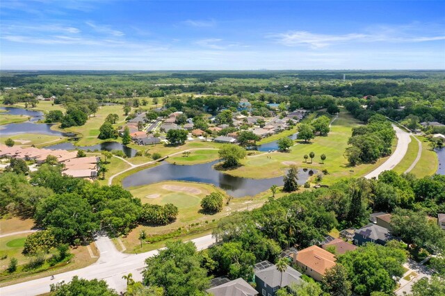 5160 Loquat Ct, Palm Harbor, FL 34685 - aerial perspective of suburban area with a golf club and a large body of water
