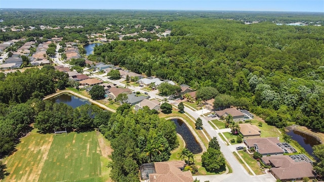 5160 Loquat Ct, Palm Harbor, FL 34685 - aerial overview of property's location with a heavily wooded area, a large body of water, and nearby suburban area