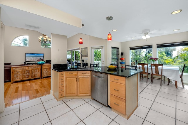405 8th Ave N, Tierra Verde, FL 33715 - kitchen with stainless steel dishwasher, light tile patterned flooring, ceiling fan, pendant lighting, and dark stone countertops