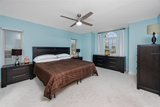 405 8th Ave N, Tierra Verde, FL 33715 - bedroom featuring light colored carpet, ceiling fan, and baseboards