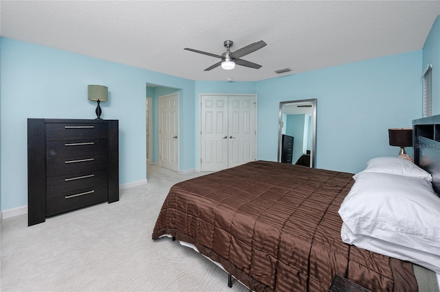 405 8th Ave N, Tierra Verde, FL 33715 - bedroom with light colored carpet, a closet, a ceiling fan, and baseboards