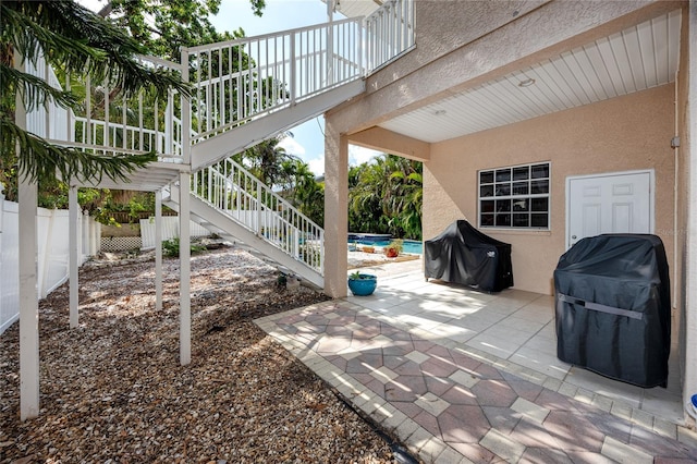 405 8th Ave N, Tierra Verde, FL 33715 - fenced backyard with a patio and a grill
