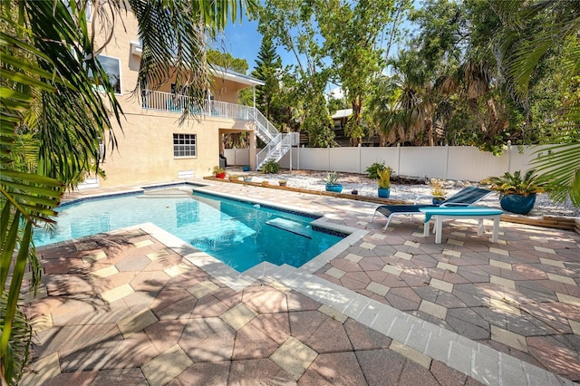 405 8th Ave N, Tierra Verde, FL 33715 - view of pool featuring stairs, a patio area, and a fenced backyard