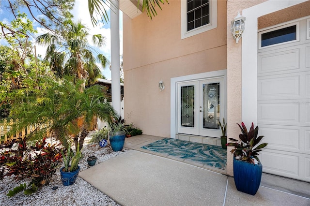 405 8th Ave N, Tierra Verde, FL 33715 - property entrance with stucco siding and french doors