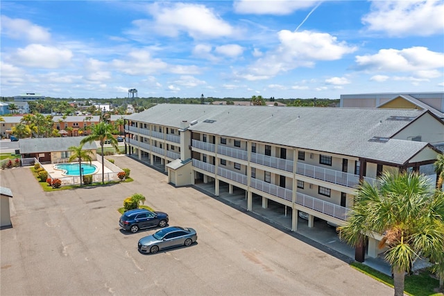 340 Causeway Blvd Unit 104, Dunedin, FL 34698 - view of building exterior with uncovered parking