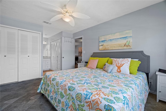 340 Causeway Blvd Unit 104, Dunedin, FL 34698 - bedroom with ceiling fan and multiple closets