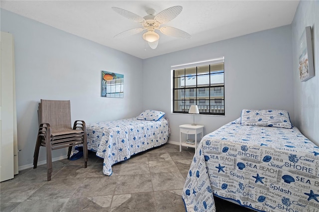 340 Causeway Blvd Unit 104, Dunedin, FL 34698 - bedroom with ceiling fan and baseboards