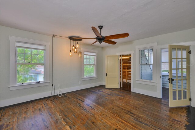 1825 2nd St S, Saint Petersburg, FL 33705 - spare room featuring wood-type flooring, ceiling fan, and baseboards