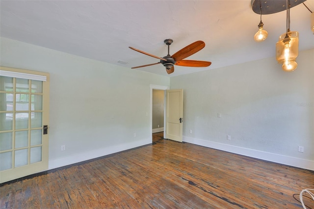 1825 2nd St S, Saint Petersburg, FL 33705 - empty room featuring baseboards, a ceiling fan, and hardwood / wood-style flooring