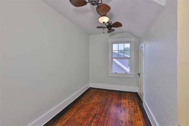 1825 2nd St S, Saint Petersburg, FL 33705 - empty room with lofted ceiling, dark wood finished floors, a ceiling fan, and baseboards