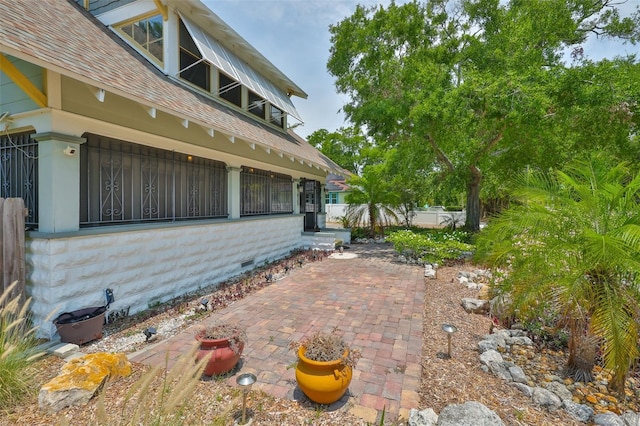 1825 2nd St S, Saint Petersburg, FL 33705 - view of property exterior with a patio