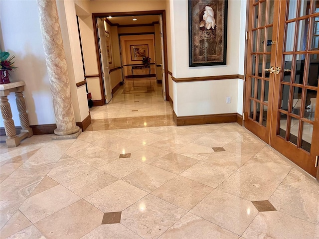 1180 Gulf Blvd Unit 306, Clearwater, FL 33767 - corridor featuring french doors, baseboards, and ornate columns