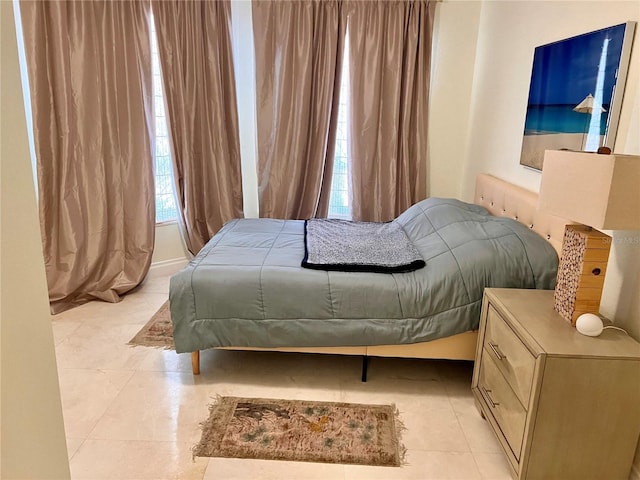 1180 Gulf Blvd Unit 306, Clearwater, FL 33767 - bedroom with light tile patterned floors