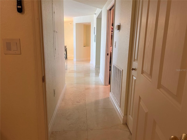 1180 Gulf Blvd Unit 306, Clearwater, FL 33767 - hall with light tile patterned flooring, baseboards, and a textured wall