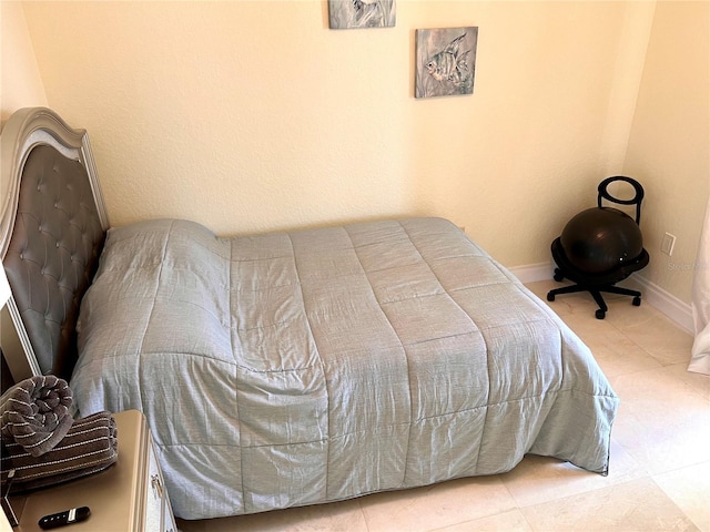 1180 Gulf Blvd Unit 306, Clearwater, FL 33767 - bedroom with baseboards and tile patterned floors