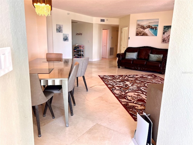 1180 Gulf Blvd Unit 306, Clearwater, FL 33767 - dining room with a chandelier