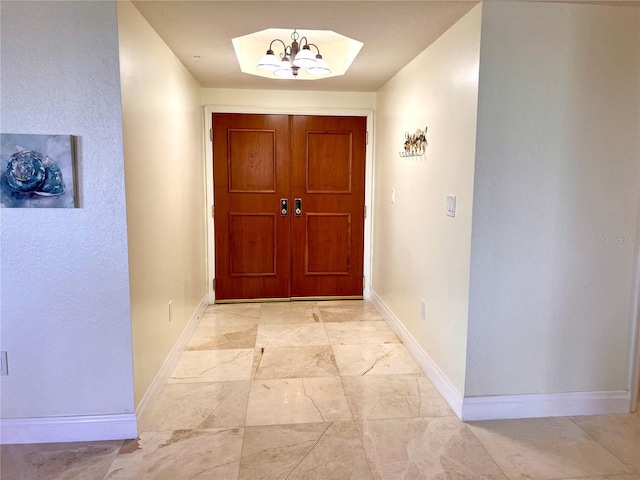 1180 Gulf Blvd Unit 306, Clearwater, FL 33767 - entryway featuring baseboards and light marble finish flooring