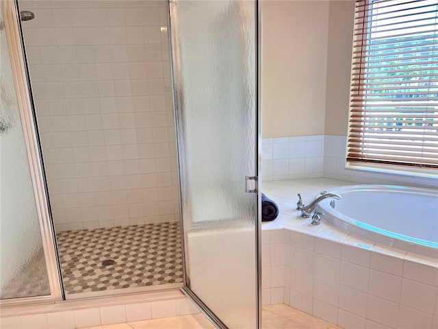 1180 Gulf Blvd Unit 306, Clearwater, FL 33767 - full bathroom featuring a shower stall and a garden tub