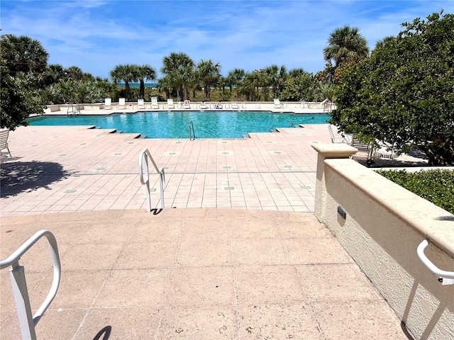 1180 Gulf Blvd Unit 306, Clearwater, FL 33767 - community pool featuring a patio area