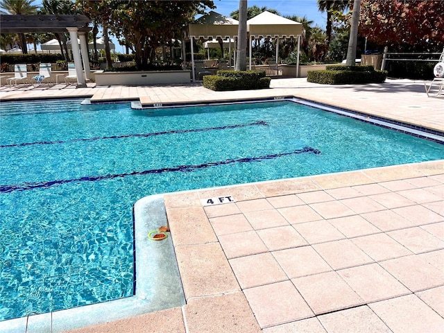 1180 Gulf Blvd Unit 306, Clearwater, FL 33767 - community pool featuring a gazebo and a patio