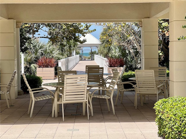1180 Gulf Blvd Unit 306, Clearwater, FL 33767 - view of patio with outdoor dining space