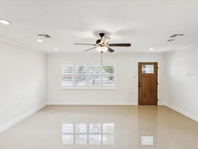2016 Cove Dr, Largo, FL 33774 - entryway with ceiling fan, crown molding, light tile patterned floors, recessed lighting, and baseboards