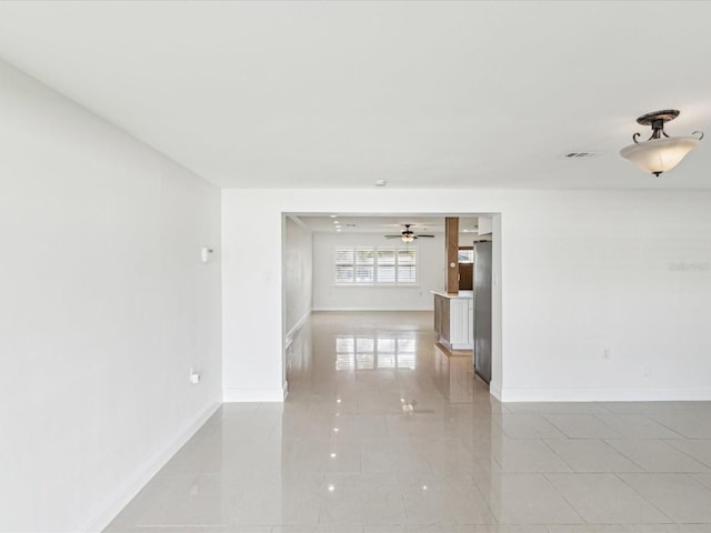 2016 Cove Dr, Largo, FL 33774 - empty room with a ceiling fan and baseboards
