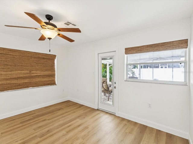 2016 Cove Dr, Largo, FL 33774 - unfurnished room with light wood finished floors, ceiling fan, and baseboards