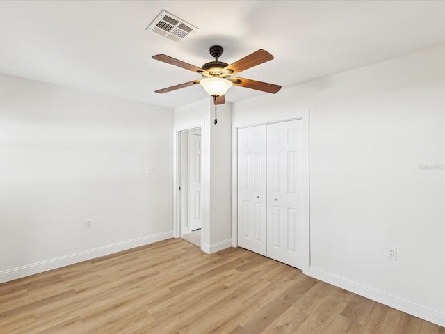 2016 Cove Dr, Largo, FL 33774 - unfurnished bedroom featuring light wood-style flooring, baseboards, and ceiling fan