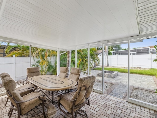 2016 Cove Dr, Largo, FL 33774 - sunroom / solarium with outdoor dining area