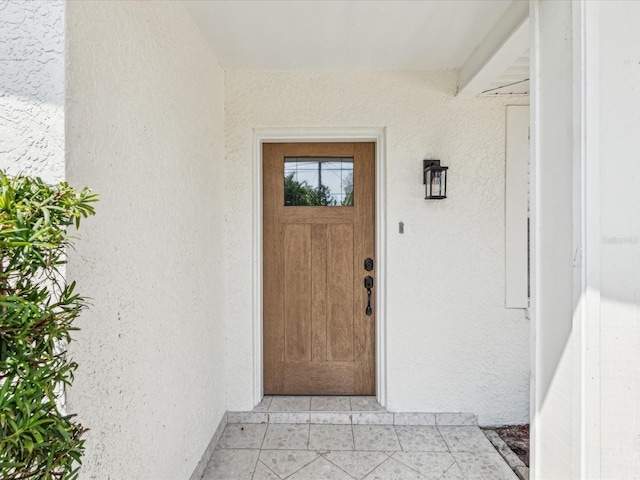 2016 Cove Dr, Largo, FL 33774 - view of exterior entry featuring stucco siding