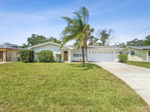 2016 Cove Dr, Largo, FL 33774 - single story home featuring driveway, a garage, a front lawn, and stucco siding