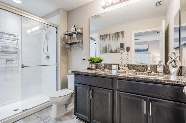 7030 Summer Holly Pl, Riverview, FL 33578 - bathroom with a stall shower, double vanity, and tile patterned flooring
