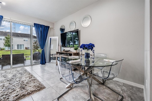 7030 Summer Holly Pl, Riverview, FL 33578 - tiled dining room featuring baseboards