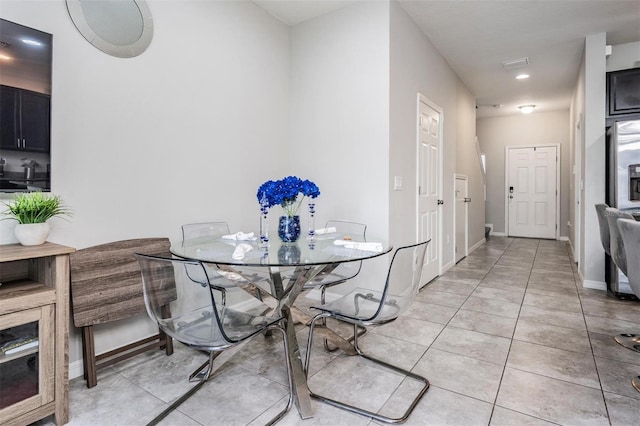 7030 Summer Holly Pl, Riverview, FL 33578 - dining area with light tile patterned flooring and baseboards