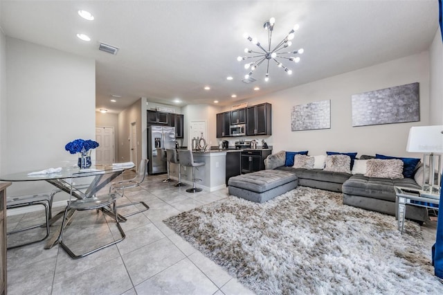 7030 Summer Holly Pl, Riverview, FL 33578 - living room with a chandelier, light tile patterned flooring, and recessed lighting
