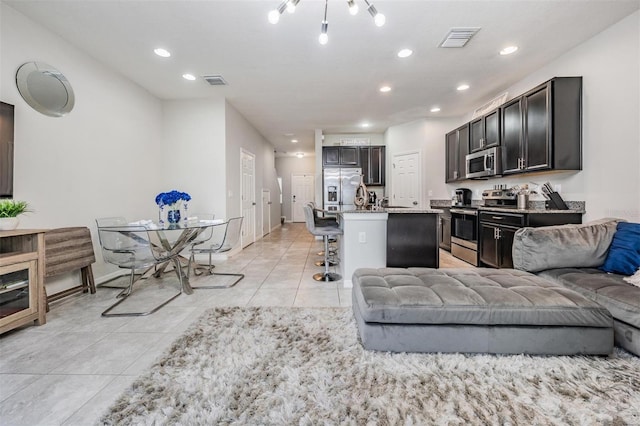 7030 Summer Holly Pl, Riverview, FL 33578 - living area with light tile patterned floors and recessed lighting